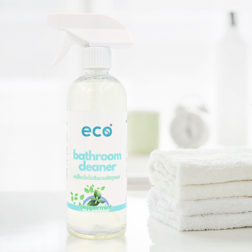 A bottle of eco bathroom cleaner on a counter, for a sustainable and eco-friendly home.
