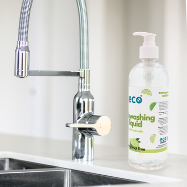 A bottle of eco dish soap bergamot lime by the kitchen sink, for an eco-friendly and sustainable home.