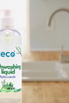 A bottle of eco dish soap rosemary mint by the kitchen sink, for an eco-friendly and sustainable home.
