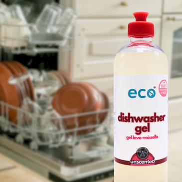 A bottle of eco dishwasher gel unscented in front of a dishwasher, for a sustainable and eco-friendly home.